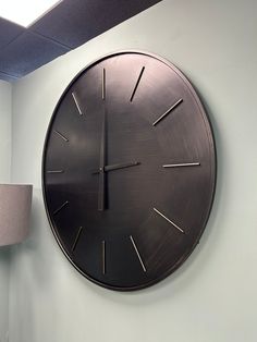 a clock mounted to the side of a wall