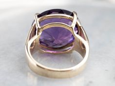 This amethyst cocktail ring makes a big statement! The amethyst is a deep purple hue with glittering tones of fuchsia and lilac. Set into an east to west style mounting, the gemstone is complimented beautifully by the warmth of the yellow gold. This ring is stylish and glamorous! Metal: 14K Yellow Gold Gem: Amethyst 20.12 Carats Gem Measurements: 17.5 x 19.4 mm, Oval Ring Size: 8.50 Marks: "14K" Stamped on the inside band Yellow Gold Sapphire Ring, Amethyst Cocktail Ring, Right Hand Ring, Fine Gold Jewelry, Purple Gems, Jewelry Drawing, Gold Cocktail Ring, Cameo Ring, Gold Cocktail