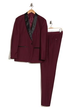 Bring understated elegance to the table in this three-piece tuxedo crafted from rich fabric in a classic single-breasted silhouette. Jacket has notched lapels; chest welt pocket; front welt pockets Vest has front button closure; V-neck Pants have zip fly with button closure; front slant pockets; back button-welt pockets Jacket and vest are lined; trousers are lined to the knee 65% polyester, 35% viscose Dry clean Imported Each suit has a 6” drop, meaning that a size 38R jacket is paired with siz Fitted Semi-formal Set With Suit Collar, Formal Tuxedo Sets With Slim Fit, Fitted Tuxedo Sets For Formal Occasions, Classic Fitted Formal Sets, Classic Fitted Evening Sets, Classic Fitted Sets For Formal Occasions, Classic Fitted Sets For Semi-formal Occasions, Tailored Evening Set With Suit Collar, Tailored Evening Sets With Suit Collar