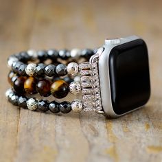 Not only does the Handmade Tigers Eye and Hematite Apple Watch Stretch Band look great, it makes the perfect gift for someone. The Tigers Eye represents the power, courage and fearlessness of the tiger. Tigers Eye is a must have if you are looking for balance and harmony in your life and will improve your sense of self-worth. You will feel empowered and confident and it can strengthen your willpower and your intention to succeed. It’s considered to be a protector of the wearer’s resources, bring Punk Couples, Handmade Watch Bands, Apple Band, Apple Watch Sizes, Tiger Eye Crystal, Bracelet Apple Watch, Stretch Bands, Heart Drop Earrings, Tiger Eye Stone