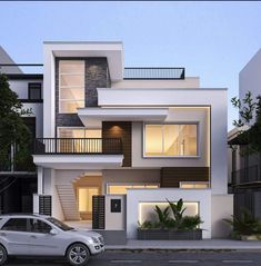 a car is parked in front of a modern house at night with stairs leading up to the second floor