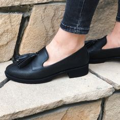 Step up your shoe game with these luxurious black tassel loafers. Crafted from high-quality leather with an embossed reptile texture, these loafers blend classic elegance with a modern twist. The sleek black finish is complemented by bold tassels that add a touch of flair to the timeless design. Perfect for both casual and semi-formal occasions, these loafers offer comfort without compromising on style. Whether you're pairing them with jeans or dress pants, these shoes are designed to make a sta Luxury Classic Slip-on Tassel Loafers, Luxury Almond Toe Tassel Loafers For Formal Occasions, Black Slip-on Tassel Loafers With Textured Sole, Black Tassel Loafers With Flat Heel For Business, Black Slip-on Tassel Loafers With Closed Toe, Black Tassel Loafers Slip-on Closed Toe, Black Tassel Loafers With Brogue Detailing, Elegant Black Tassel Loafers With Textured Sole, Black Tassel Loafers With Rubber Sole And Flat Heel