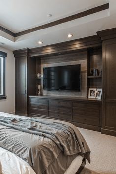 Aerial view of modern bedroom TV wall design ideas with built-in wall unit and calm aesthetic Modern Bedroom Tv Wall, Bedroom Tv Wall Design, Tv Wall Design Ideas, Bedroom Upstairs, Owners Suite, Tv Over Fireplace, Calm Aesthetic, Bedroom Wall Units, Bedroom Tv Wall