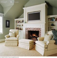 a living room filled with furniture and a fire place in front of a flat screen tv