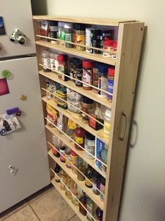 an organized pantry is shown in this kitchen