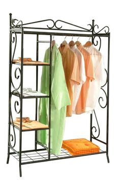 an iron rack with clothes and towels on it