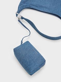 This product is made with at least 20% sustainable materials by weight. CHARLES & KEITH uses recycled, degradable, organic, and water-based materials in our eco-conscious collection. Re-introduce denim to your wardrobe with the Lumen hobo bag. Slouchy folds add to the laidback charm of the denim finish, while clean curves give it a sophisticated appeal. The hobo bag style makes it easy to tuck snugly under the arm, all while possessing a spacious interior to fit all that you need in. For your smaller items, the accompanying inner pouch will come in handy. Slouchy Hobo Bag, Charles Keith, Bag Style, Eco Conscious, Sustainable Materials, Kids Gifts, Denim Blue, Bag Straps, Hobo Bag