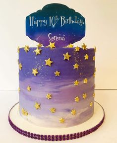 a purple and gold birthday cake with stars on it