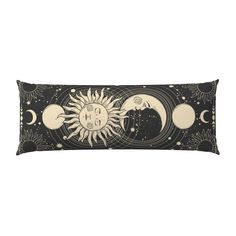 a black and white rectangular pillow with the sun, moon and phases on it's side