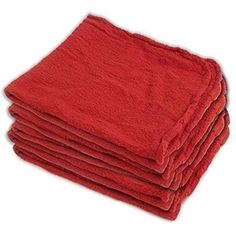 six red towels stacked on top of each other in front of a white background,