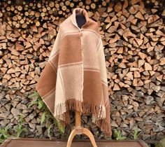 "The thick beige brown scarf is sewn from lamb's wool knit, wide and warm. Dimensions without fringes: 180 x 80 cm/ ~70 x 31 inches/, approximate weight: 870 g /1.92Lb/. Care tips for wool products. It is best to dry clean wool products (symbol \"P\") or wash by hand in lukewarm water(under 30 oC or 86 oF) with a liquid detergent. Machine wash in wool or delicate mode using a low speed spin or without using a centrifuge( also below 30 oC or 86 oF), allowing excess water to drain freely by curling the blanket over a thick cord or rod. Do not expose to heat or sunlight. Ironing. Adjust the iron to a two-point mark (Wool), iron from the left, preferably through a moistened white cotton cloth. You can also steam iron with just a light touch of the material." Shoulder Scarf, Wool Products, Brown Scarf, Check Scarf, Brown Scarves, Checked Scarf, Wool Wrap, Liquid Detergent, Wool Knit