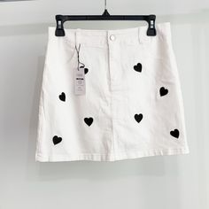 -Cider Denim Mini Skirt -Nwt -Size: Medium -White W/ Black Hearts -Zip & Button Front Enclosure -Smoke Free Home White Heart Print Bottoms For Summer, White Cotton Bottoms With Heart Print, Casual White Bottoms With Heart Print, Trendy White Spring Denim Skirt, Trendy White Denim Skirt For Spring, Ruffle Long Skirt, Olive Mini Skirt, Mini Skirt White, Y2k Mini Skirt