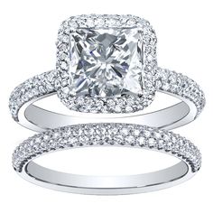 an oval cut diamond ring and matching wedding band