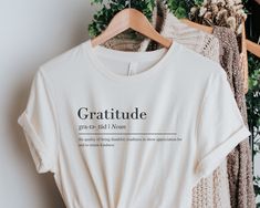 Embrace and attitude of gratitude with this gratitude definition tee! This makes a great gift for yourself, or someone else looking to bring a grateful energy into their life! This Bella Canvas 3001 unisex t-shirt is soft and lightweight, the comfiest shirt you will own! It's comfortable and flattering for both men and women.  - Unisex sizing please refer to the sizing chart in the listing photos - 100% combed and ring-spun cotton  - Medium fabric weight   PRINTING - DTG (Direct To Garment) Prin Grateful Tshirt, Gratitude Definition, Definition Tshirt, Grateful Shirt, Comfy Shirts, Attitude Of Gratitude, Sizing Chart, Tshirt Colors, Positive Vibes