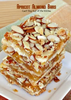 a stack of almond almond bars sitting on top of a white plate