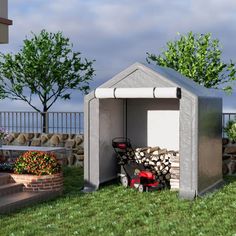 a small shed sitting on top of a lush green field next to a pile of firewood