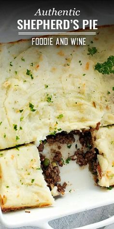 an image of shepherd's pie with cheese and wine in the middle on a plate