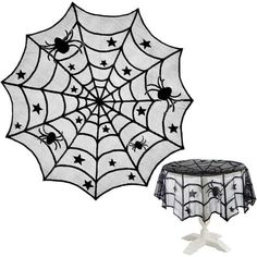 a spider web table cover with two spider webs on it