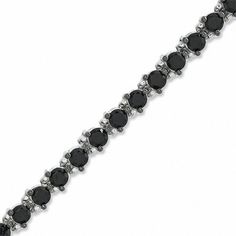 This new take on the traditional tennis bracelet is a great look for the modern sophisticate. Fashioned in sleek sterling silver, an array of glistening black spinel in three-prong settings is linked in perfect alignment, creating this bold and dramatic look. Buffed to a brilliant shine, this 7.5-inch bracelet secures with a lobster claw clasp. Formal Tennis Bracelet With Black Diamonds, Classic Black Diamond Bracelet For Formal Occasions, Elegant Bracelet With Black Diamonds, Elegant Black Diamond Round Bracelets, Formal Bracelets With Black Diamonds, Elegant Black Diamond Round Bracelet, Classic Round Black Diamond Bracelet, Elegant Black Tennis Bracelet For Anniversary, Elegant Black Bracelets For Anniversary