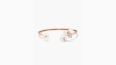 handcrafted of rose gold-tone metal and mother-of-pearl shell our precious pansy collection is true to its name. and this flex cuff is designed with lots of thoughtful details: like the sparkly crystal centers and heart-shaped petals. did you notice the larger ones? they're a nod to our signature mark. | Kate Spade Precious Pansy Flex Cuff, Cream/Rose Gold Spring Formal Rose Gold Jewelry, Spring Gift Jewelry By Kate Spade, Kate Spade Elegant Bangle Jewelry, Elegant Rose Gold Bracelets For Spring, Kate Spade Feminine Wedding Jewelry, Feminine Kate Spade Jewelry For Wedding, Feminine Kate Spade Wedding Jewelry, Elegant White Kate Spade Bracelet, Kate Spade Rose Gold Bracelet Gift