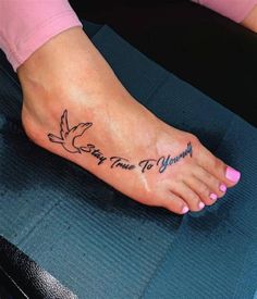 a woman's foot with a tattoo that says stay true to yourself on it