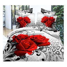 a bed with red roses on it in a room