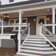 a house with stairs leading up to the front door