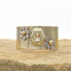 D E T A I L S :Hexagon Diamond Flower Ring, One of a Kind RingGemstones: 1.18 ct GIA Certified VS2 Pale Yellow ElongatedHexagon DiamondMetal: 14K solid yellow gold, 14K solid white gold accentsBand Width: 1/2 inchSize: Sizable from about 5.5-9 (please allow 2 weeks for sizing)One of a kind JewelryHandmade by Jen in the USA ______________ FINE JEWELRY THAT IS ONE OF A KIND - JUST LIKE YOU: This diamond is just glorious and the ring is the perfect compliment to the Diamond and emerald bumblebee cu Hexagon Ring With Single Cut Diamonds For Anniversary, Gold Hexagon Rose Cut Diamond Jewelry, Hexagon Rose Cut Diamond Gold Jewelry, Yellow Gold Hexagon Rose Cut Diamond Jewelry, White Gold Octagon Rings With Rose Cut Diamonds, Fine Jewelry With Hexagon Rose Cut Diamonds, Fine Jewelry With Rose Cut Diamonds Hexagon, Fine Jewelry With Hexagon Shaped Rose Cut Diamonds, Ring Yellow Diamond