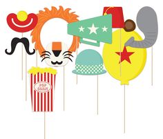 an assortment of carnival photo booth props including masks, popcorn boxes and stars on sticks