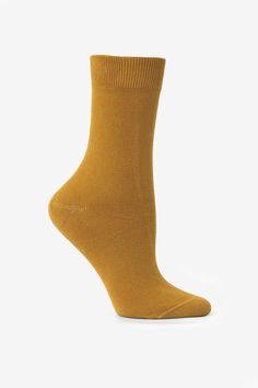 A classic lightweight sock with a traditional mid-calf rise that hits a few inches above the ankle. These socks feature a flat knit body with a ribbed top to keep them up throughout the day. Please note: select colors of this sock are garment dyed and enzyme washed which can result in subtle irregularities, softer fibers and a slightly more textured hand. • Unisex• Made in Los Angeles, Calif.• Crew Sock• 100% Shrink Free Garment dye Cotton | Summer Sock in Amber, Size 6~9 Classic Solid Winter Socks, Classic Winter Socks, Casual No-show Winter Socks, Classic Fall Socks, Casual Solid Socks For Fall, Classic Mid-calf Fall Socks, Solid Ribbed Socks For Fall, Classic Comfortable Solid Color Socks, Comfortable Classic Solid Color Socks