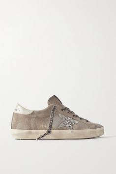 Golden Goose's passion for the imperfect is what sets its designs apart. These leather-trimmed 'Super-Star' sneakers are made from taupe suede, which is distressed and lightened for a uniquely worn-in look. The signature star emblem gets a glittery upgrade, supplying an extra dose of serotonin alongside leopard-print laces. Suede Trainers, Golden Goose Sneakers, Golden Goose Shoes, Golden Goose Deluxe Brand, Shoe Inspo, Brown Sneakers, Latest Sneakers, Star Sneakers, Super Star