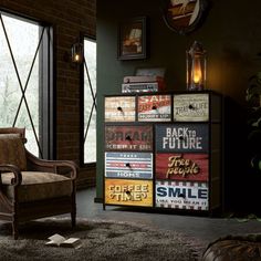 a living room filled with furniture next to a brick wall and large glass doors that look out onto the outdoors