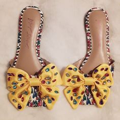 Made By Betsey Johnson, It's Her Daisyy-R Rhinestone Yellow Bow Slide Fashion Sandals. Featuring Yellow Bows With Colorful Rhinestones, Along With Rainbow Hearts On Platform. Sandals Were A Sample From The Premiere Launch In 2021, As Shown Underneath Each Shoe, So They Don't Contain Size, But Are Approximately A 5.5 Or 6 In Women's Shoes. Never Worn. Multicolor Rhinestone Sandals For Spring, Spring Bedazzled Flat Sandals, Multicolor Rhinestone Sandals For Summer, Summer Multicolor Sandals With Rhinestones, Chic Bedazzled Heels For Summer, Chic Flat Sandals With Rhinestones, Spring Bedazzled Sandals, Glamorous Multicolor Sandals For Spring, Spring Crystal Embellished Flat Heels