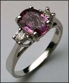 Our beautiful 14k white gold pink sapphire and diamond 3 stone ring features a 1.27ct pink sapphire center. 2 G color, VS1 clarity diamonds totaling .20ct compliment the pink sapphire on this 14k white gold ladies ring.  SKU: R508    Item:  Pink Sapphire 3 Stone Ring with Diamonds Stone Weight: 1.27ct Pink Sapphire  Gold: 14kt White Gold  Diamond Weight: .20ct Diamond  Diamond Quality: G Color, VS1 Clarity  Length: 1/4" 3 Stone Ring, 3 Stone Rings, Ladies Ring, Diamond Stone, Stone Ring, Pink Sapphire, The Pink, White Gold Diamonds, Women Rings