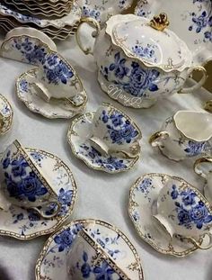 a table topped with lots of blue and white dishes