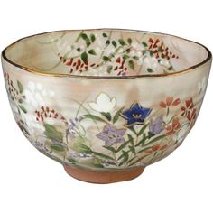 a bowl with flowers painted on it