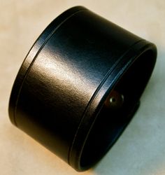 This 2 black American bridle leather cuff is perfectly sized for your wrist. The edges are scribed, beveled, slicked smooth and sealed. 2 high quality hand polished brass snaps provide the closure. Ill need your wrist size for this cuff. Instructions in the pics above! For more info on my work please visit http://freddiematara.com Thx! Freddie LIVE●LOVE♥LEATHER Classic Wide Band Cuff Bracelet, Adjustable, Classic Leather Bracelet With Waxed Finish, Classic Leather Cuff Bracelet, Leather Cuff Bracelet For Formal Occasions, Classic Black Leather Bracelet For Formal Occasions, Formal Leather Cuff Bracelet, Elegant Black Leather Cuff Bracelet, Classic Leather Bracelet With Black Band, Black Leather Cuff Bracelet For Formal Occasions