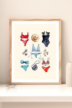 an art print of various swimsuits and hats on a shelf next to a lamp