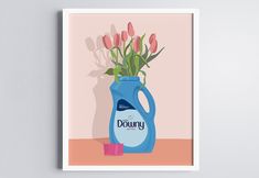 a blue vase with pink tulips in it sitting on top of a table