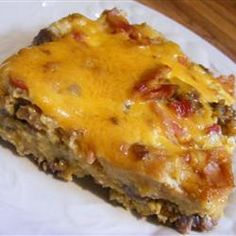 a piece of meat and cheese casserole on a plate