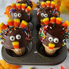 chocolate cupcakes decorated like turkeys with sprinkles