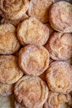 a pile of powdered sugar cookies sitting on top of a table