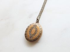 "Vintage style Oval Locket Necklace / Long Chain Oval Locket Necklace / Simple Oval Locket / Initial Disc Locket / Personalized Locket / Grandma Gift / Mothers day Gift / Bridesmaid Gift / Dainty Necklace / Birthday Gift / Gift idea ■ ITEM DETAILS: +Materials : ▶ Locket, Chain - silver burnish plated over brass, gold burnish plated ▶ Initial coin - Sterling silver, Brass +Size : ▶ Locket - 12mm * 19mm (outer size) ▶ Initial coin - 9mm +Chain Length ▶ If you want a chain length other than the opt Oval Necklaces With Engraving Option For Wedding, Wedding Medallion Locket Necklace With Engraving Option, Oval Locket Necklace With Engraving Option For Wedding, Adjustable Medallion Locket Necklace For Wedding, Antique Gold Wedding Locket Necklace With Intricate Design, Personalized Oval Locket Necklace For Wedding, Antique Gold Oval Pendant Necklace For Wedding, Oval Vintage Charm Locket Necklace For Wedding, Antique Gold Locket Necklace For Wedding