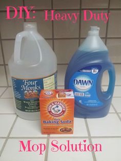 two gallon jugs of dawn soap, one bottle of dawn baking soda and the other container of dawn baking soda