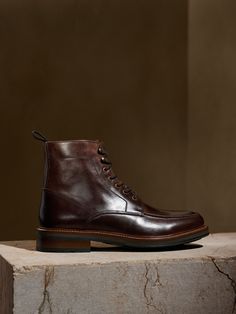 Rugged yet refined, this waxed calf-leather lace-up boot is mounted on a durable low profile lug rubber sole.  This pair features an apron style toe, with exposed antique brass eyelets and speed hooks, with a grosgrain pull tab.  Calfskin lined, this Work Boots Outfit, Men Reference, Gentlemen Wear, Gentleman Shoes, Wedding Boots, Mens Ankle Boots, An Apron, Shoes Photography, Winter Outfits Men