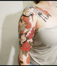 a woman with a tattoo on her arm