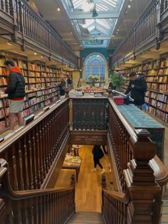 the inside of a library with many bookshelves