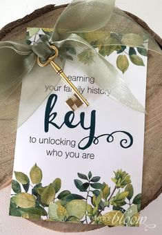 a key to unlock who you are is hanging on a piece of wood with ribbon