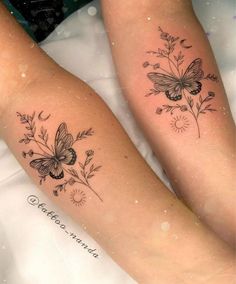 two women with tattoos on their legs sitting next to each other, both showing butterflies and flowers