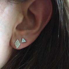 Simply Stunning At NicoleHD we love creating minimal and modern designs that will perfectly fit your aesthetic! While these diamond triangle studs are amazing for a casual, everyday look, they can also be dressed up along with other bold jewelry. Beauty refined A modern take on the diamond stud, this edgy Diamond Triangle earring can be worn anywhere along the ear, and without cups or prongs, it appears to float weightlessly! Available in 14K rose, yellow, or white gold With .13ct tw small and .